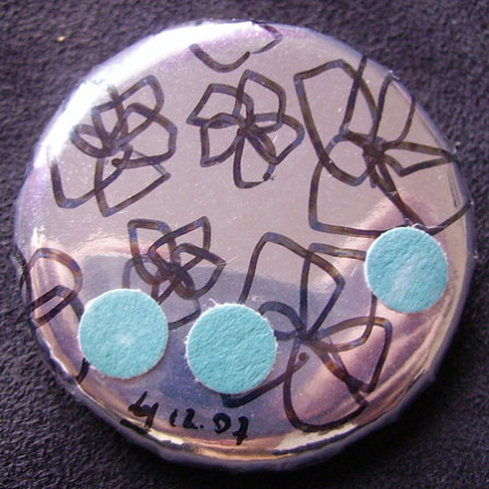 Badge Fleurs sur Miroirs