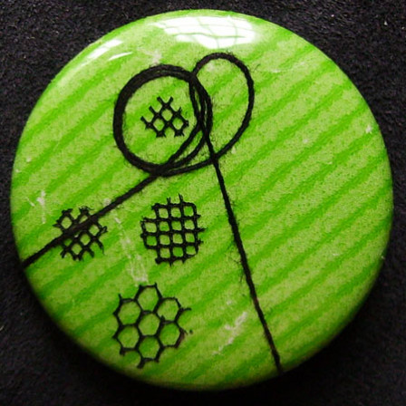 Badge Crépitement Noir sur Pomme