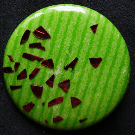 Badge Dispersion Rouge sur Pomme