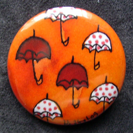 Badge Parapluies Orange et Pois