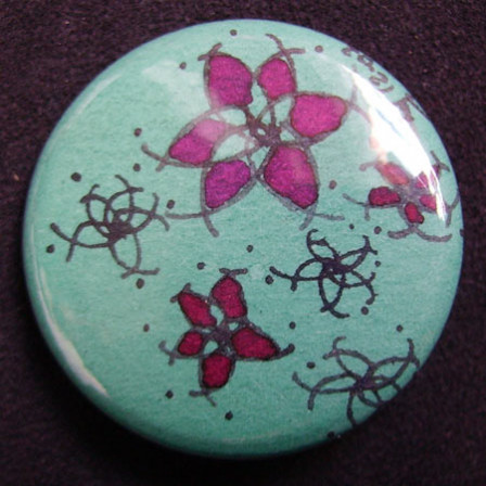 Badge Fleurs Fushia et Turquoises